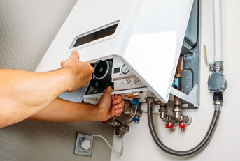 Hand opening electric panel on the wall