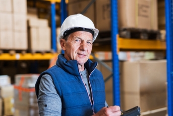 Senior man working in warehouse