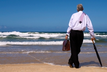 man looking gazing in thought out to sea