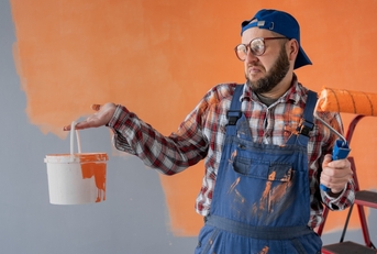 Man looking at paint