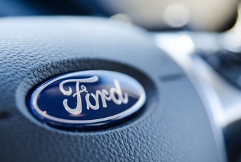 Ford sign on steering wheel close up