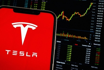 Smartphone Displays Tesla Logo (TSLA Shares) Stock Market Chart