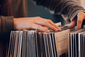 Going through vinyl records at store