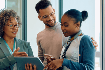 Financial advisor with young couple going over savings account
