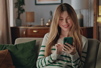 Young woman checking online banking on phone