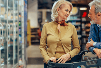 Boomer couple shopping for groceries