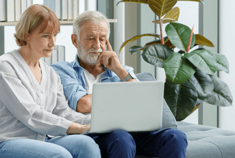Senior couple looking at retiring and savings