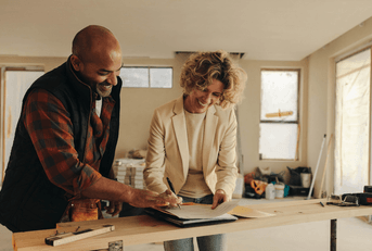 Woman signing contract for kitchen remodel