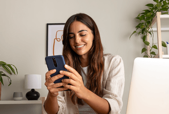 Woman checking CD rates on phone
