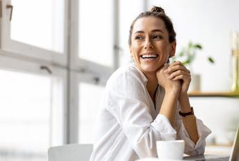 creative young woman working on laptop in her studio