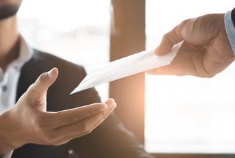office worker receiving extra money from boss as a reward 