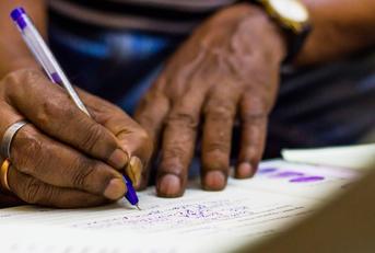african american man signing important documents