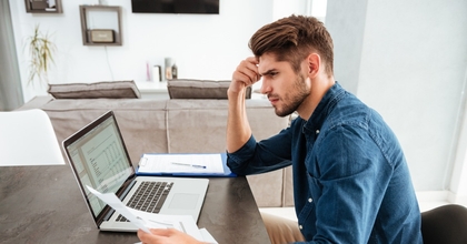 man looking at paperwork