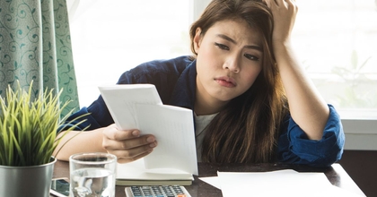 Woman Looking at Taxes