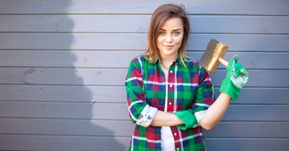 Woman painting house