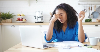 Young woman stressed about debt