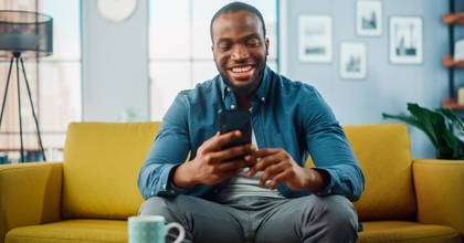 Man smiling at phone