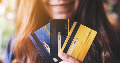 woman holding credit cards