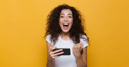 Happy woman holding cellphone