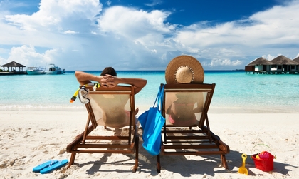 couple relaxing by the beach on a vacation