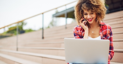 Smiling girl on laptop