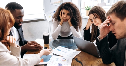 Tired business team are having a briefing meeting