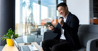 man excited in an airport lounge