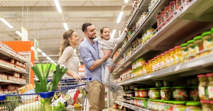 happy family at the grocery store shopping