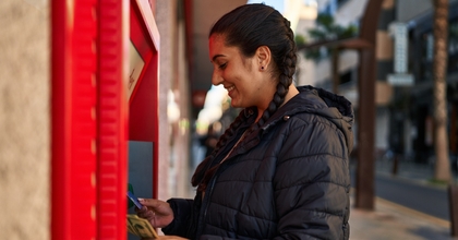 Woman using an ATM