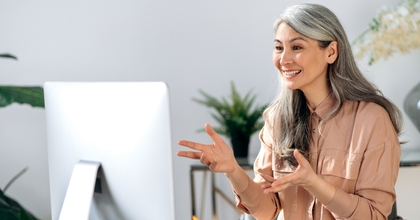 mature asian woman communicates by video call