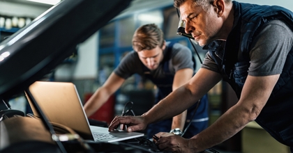 Mechanic using laptop
