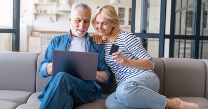 A couple researching best balance transfer cards