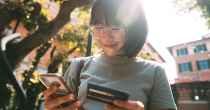Smiling woman looking at her phone