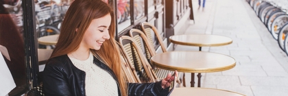 Woman sitting outside cafe