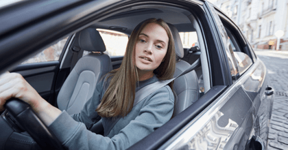 young driver backing car up