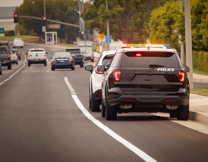 police car pulling over a vehicle