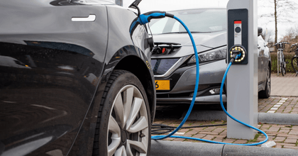 Electric vehicles are being charged at a charging station.