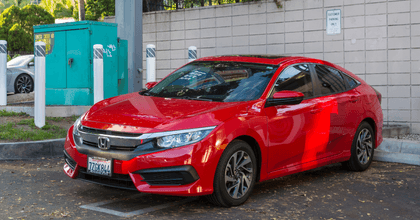 red honda civic in a parking lot