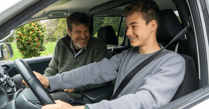 Father teaching teen son to drive