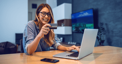 Woman with laptop and credit card