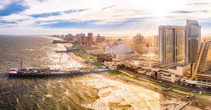 Atlantic City, New Jersey, as seen from aerial view featuring boardwalk and buildings