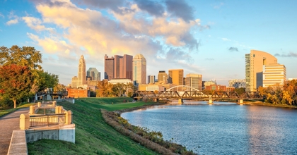 Ohio landscape showing Columbus skyline and buildings with lake in the foreground