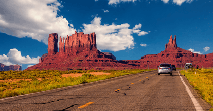Cars on highway in Monument Valley, Utah