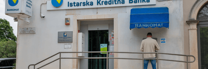 person withdrawing money from atm in croatia