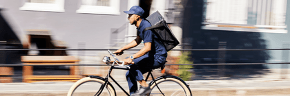 person working delivery gig on bike