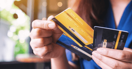 Woman holding and choosing credit card