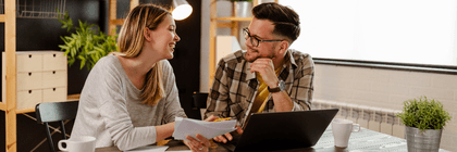 Couple doing finances on laptop
