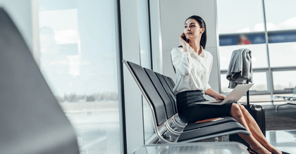 traveler on phone and laptop