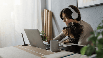 person listening to music on laptop