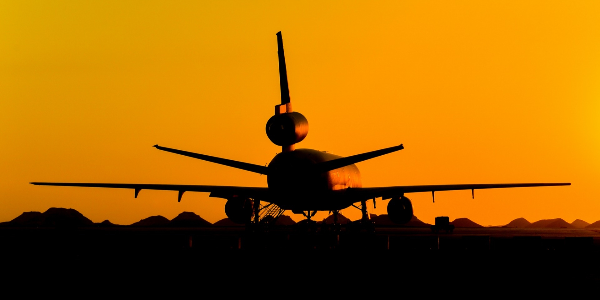 plane at sunset Zoom background